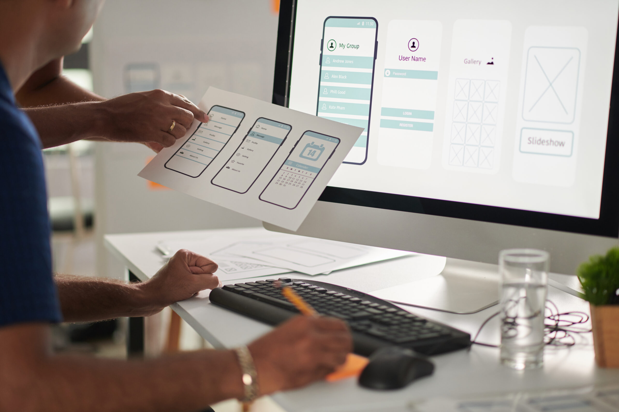 Designers working on web application interface and user experience design with wireframes and desktop screen | Webface