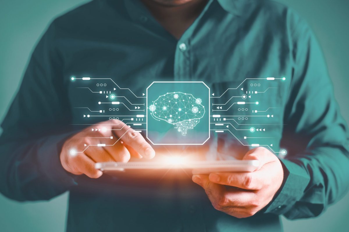Man using tablet with digital brain interface symbolizing AI integration and smart automation | Webface